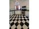 Bright kitchen with black and white checkered flooring and modern stainless steel appliances at 4000 Wilson Ln, Charlotte, NC 28206