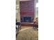 Spacious living room featuring a brick fireplace, hardwood floors and a neutral area rug at 4000 Wilson Ln, Charlotte, NC 28206