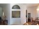 Well-lit living room with hardwood floors, arched doorway, and modern furnishings at 4000 Wilson Ln, Charlotte, NC 28206
