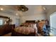 Spacious main bedroom featuring a vaulted ceiling, ceiling fan, and hardwood flooring at 4000 Wilson Ln, Charlotte, NC 28206