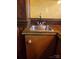 A sink with wood colored cabinets, drawers and stainless steel sink at 4000 Wilson Ln, Charlotte, NC 28206