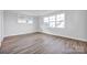 Bedroom with large windows and hardwood floors at 613 Hops Aly, Fort Mill, SC 29715