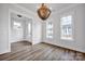 Bright dining room featuring a decorative chandelier and hardwood floors at 613 Hops Aly, Fort Mill, SC 29715