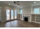 Spacious living room with fireplace, built-in shelving, and French doors at 613 Hops Aly, Fort Mill, SC 29715