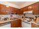 Efficient kitchen featuring wood cabinets and a full suite of appliances at 3722 Park Rd # Q, Charlotte, NC 28209