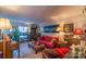 Cozy living room featuring a piano, comfy sofa, and ample natural light at 3722 Park Rd # Q, Charlotte, NC 28209