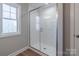 Bright shower featuring clear glass doors, and white subway tile from floor to ceiling at 118 Alf Hoover Rd, Lincolnton, NC 28092