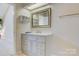 Bright bathroom vanity with modern fixtures, drawers, and a decorative mirror at 1652 12Th Ne St, Hickory, NC 28601