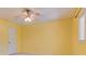 Bedroom featuring bright yellow walls and a lighted ceiling fan at 1652 12Th Ne St, Hickory, NC 28601