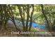 Scenic creek view from sunroom at 1652 12Th Ne St, Hickory, NC 28601