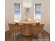 Bright dining area featuring a round wood table, modern light fixture, and woven chairs at 1652 12Th Ne St, Hickory, NC 28601