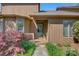 Inviting front entrance with a well-maintained small porch, featuring natural light and fresh landscaping at 1652 12Th Ne St, Hickory, NC 28601