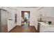 Renovated kitchen featuring white cabinets with gold hardware, marble counters, and stainless steel appliances at 1652 12Th Ne St, Hickory, NC 28601