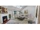 Modern renovated living room featuring a cozy fireplace, ample seating and bright natural lighting at 1652 12Th Ne St, Hickory, NC 28601