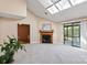 Spacious living room with fireplace, sliding glass doors, carpeted floors and abundant natural light at 1652 12Th Ne St, Hickory, NC 28601