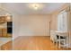 Bright living area with wood floors, desk, and large window allowing natural light in at 1652 12Th Ne St, Hickory, NC 28601