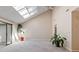 Airy living room boasting skylights, neutral carpet, sliding doors, and a ceiling fan for added comfort at 1652 12Th Ne St, Hickory, NC 28601