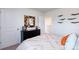 Neutral bedroom featuring a dresser with decorative mirror and airplane wall art at 3880 Maxwell Henry Nw Ln, Conover, NC 28613