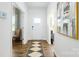 Inviting foyer with hardwood floors, a decorative rug, and ample natural light at 3880 Maxwell Henry Nw Ln, Conover, NC 28613