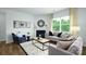 Bright living room showcasing modern furnishings, a fireplace, and natural light at 3880 Maxwell Henry Nw Ln, Conover, NC 28613