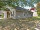 Side view of a home with gray siding and visible landscaping at 1623 Forest Stream Ct, Charlotte, NC 28213