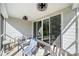 Relaxing covered patio with comfortable seating, ceiling fans, and sliding glass doors to the interior at 31226 Cove View Ct, Lancaster, SC 29720