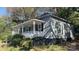 Charming gray house with front porch and satellite dish at 322 S Liberty St, Gastonia, NC 28052