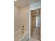 Close-up of a soaking tub with chrome fixtures and a view into the walk-in closet at 4342 Allenby Pl, Monroe, NC 28110