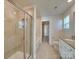 Bright bathroom featuring a glass-enclosed shower, soaking tub, and neutral color scheme at 4342 Allenby Pl, Monroe, NC 28110