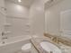 A modern bathroom featuring tile floors, a bath tub, and a granite countertop at 4342 Allenby Pl, Monroe, NC 28110