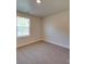 Cozy bedroom featuring neutral carpet, a window, and ample natural light at 4342 Allenby Pl, Monroe, NC 28110