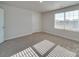 Bedroom with a large window offering natural light, and neutral carpet flooring at 4342 Allenby Pl, Monroe, NC 28110