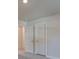 Bedroom with neutral carpet and white doors, one leading to another room at 4342 Allenby Pl, Monroe, NC 28110