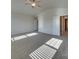 A large bedroom featuring carpet flooring, neutral walls, and multiple doors at 4342 Allenby Pl, Monroe, NC 28110
