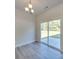 Bright dining area with sliding glass doors leading to the backyard patio and hardwood floors at 4342 Allenby Pl, Monroe, NC 28110