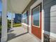 Covered front porch with stone accents and wood-look siding and trim at 4342 Allenby Pl, Monroe, NC 28110