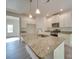 Spacious kitchen island, stainless steel appliances and abundant white cabinets and granite countertops at 4342 Allenby Pl, Monroe, NC 28110