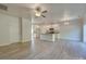 Open-concept living room and kitchen featuring wood-look flooring, white trim, and ample natural light at 4342 Allenby Pl, Monroe, NC 28110