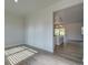 Bright living room with wood-look floors next to open-concept kitchen at 4342 Allenby Pl, Monroe, NC 28110