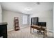 Bright bedroom with window, desk, and shelving at 7041 Barnstone Ct, Denver, NC 28037