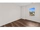 Spacious bedroom with hardwood floors and a window offering street view at 8603 Mcclure Cir, Charlotte, NC 28216