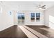 Spacious living room with hardwood floors and sliding glass doors at 8603 Mcclure Cir, Charlotte, NC 28216