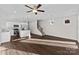 Bright living room with hardwood floors and ceiling fan at 8603 Mcclure Cir, Charlotte, NC 28216