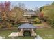 Aerial view of a home with a lakefront dock and lush landscaping at 271 Lockhard Cir, Troutman, NC 28166