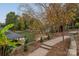 Pathways lead to the lake with landscaping and a boat dock for lakeside enjoyment at 271 Lockhard Cir, Troutman, NC 28166