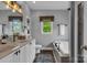 Bright bathroom featuring double vanity sinks, modern fixtures, and a soaking tub for a spa-like experience at 271 Lockhard Cir, Troutman, NC 28166