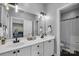 Bright bathroom featuring double sinks, a large mirror, and updated fixtures at 271 Lockhard Cir, Troutman, NC 28166