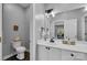 Bathroom with a sink, toilet, vanity, and a large mirror at 271 Lockhard Cir, Troutman, NC 28166