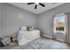 Bright bedroom with a bed, area rug, and natural light from a window at 271 Lockhard Cir, Troutman, NC 28166
