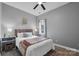 Comfortable bedroom featuring a full-size bed, stylish decor, wood floors, and a ceiling fan at 271 Lockhard Cir, Troutman, NC 28166